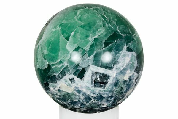 A polished sphere of massive fluorite from Mexico.